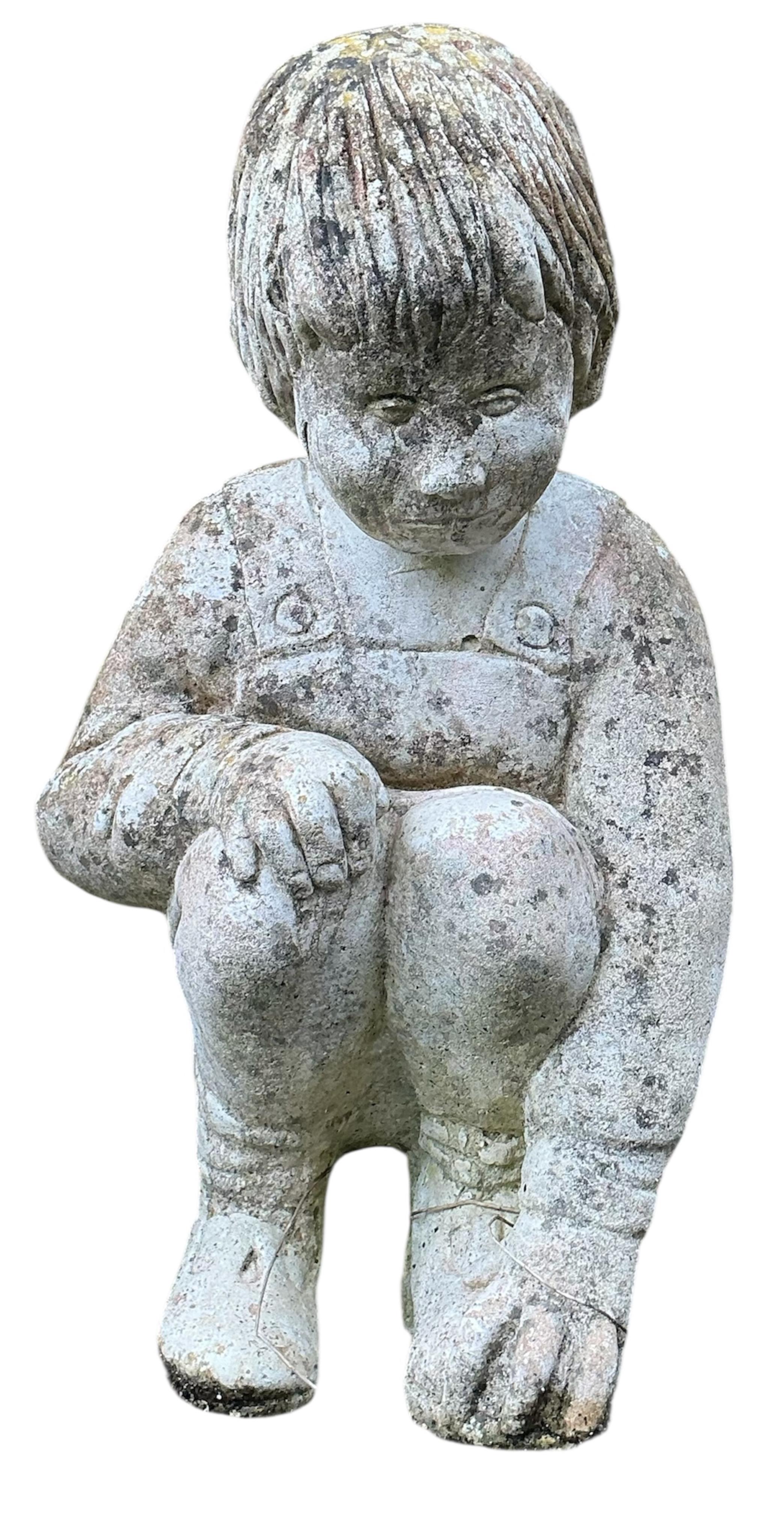 Two reconstituted stone seated child garden ornaments, larger height 56cm